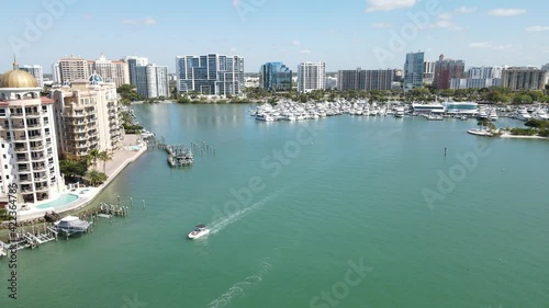 beautiful fast-moving forward aerial of downtown Sarasota, Florida, and the apartments and condominiums of Golden Gate Point photo