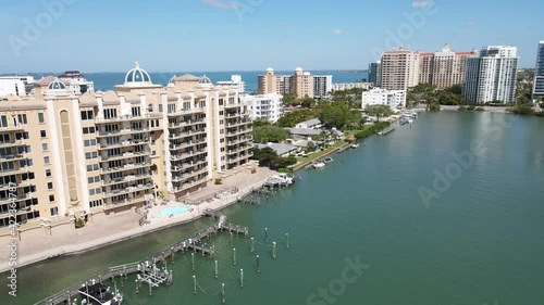 beautiful fast-moving aerial of downtown Sarasota, Florida, and the apartments and condominiums of Golden Gate Point photo