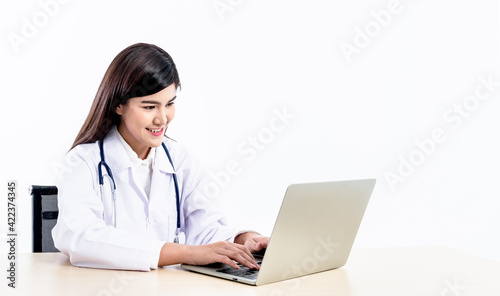 Asian attractive woman doctor using computer notebook To provide advice to patients By communication online On white background, to health care and doctor online concept.