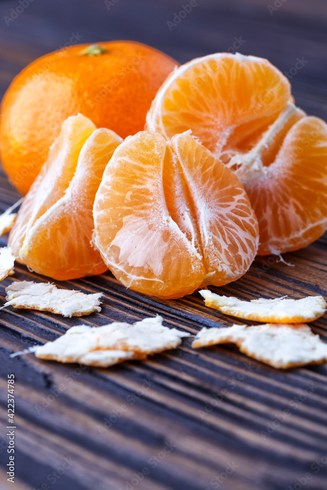 Mandarine orange or tangerine on wooden board