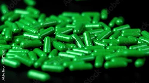 falling green pills capsule