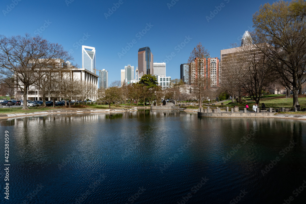 Skyline of downtown Charlotte, NC as seen from Marshall Park on an early spring day