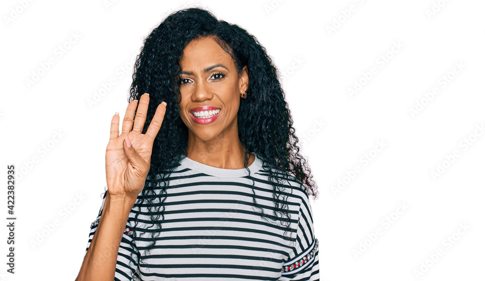 Middle age african american woman wearing casual clothes showing and pointing up with fingers number four while smiling confident and happy. Middle age african american woman wearing casual clothes showing and pointing up with fingers number four while smiling confident and happy.
