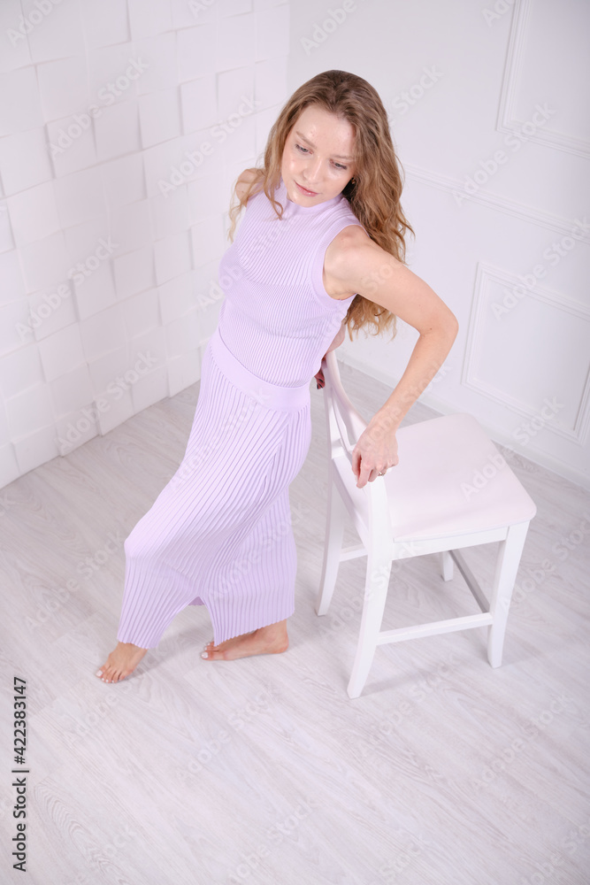 Young beautiful girl show clothes for an online store. Bright clothes. Young beautiful girl show clothes for an online store. Bright clothes.