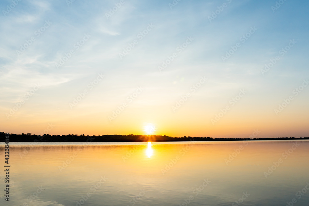 Sunset in the lake, beautiful sunset above the sea landscape background