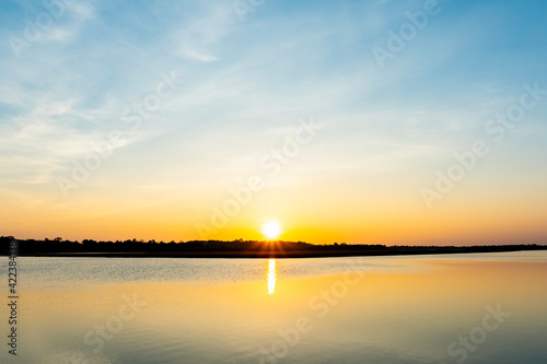 Sunset in the lake, beautiful sunset above the sea landscape background