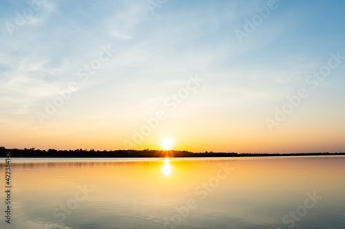 Sunset in the lake, beautiful sunset above the sea landscape background