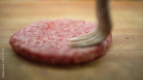 raw cutlet for burgher close-up on the table. Food preparation process. 4k