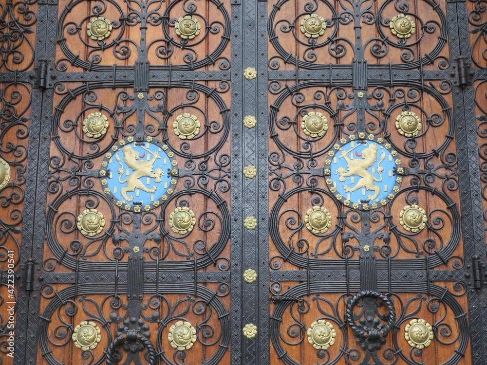 entrance door of the Rijksmuseum in Amsterdam with two golden lions entrance door of the Rijksmuseum in Amsterdam with two golden lions