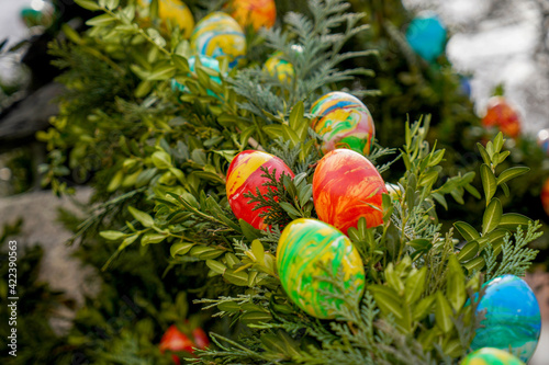 Easter is a religious festival with colored eggs and decorated bushes and fountains