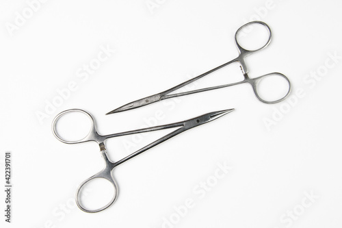 Pair of steel surgical scissors on white background