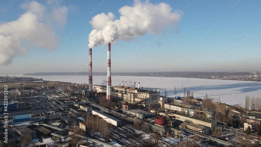 Aerial view of industrial zone with factory emission of carbon gas and smoke from factory pipes in city. Industrial factory pollution of carbone gases of ecology Aerial view of industrial zone with factory emission of carbon gas and smoke from factory pipes in city. Industrial factory pollution of carbone gases of ecology