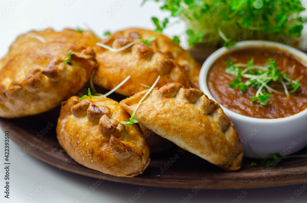 Mini pasties with tomato sauce, succulent pork, turkey, bacon and cranberry all wrapped in shortcrust pastry