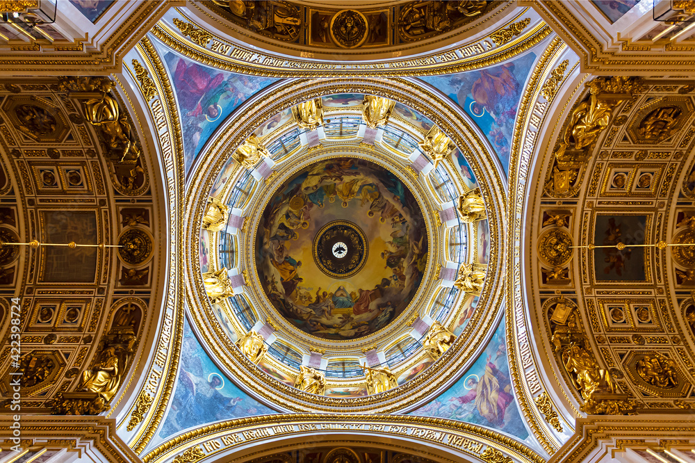 The interior of St. Isaac's Cathedral, the dome with frescoes and gilded stucco. Saint Petersburg, Russia