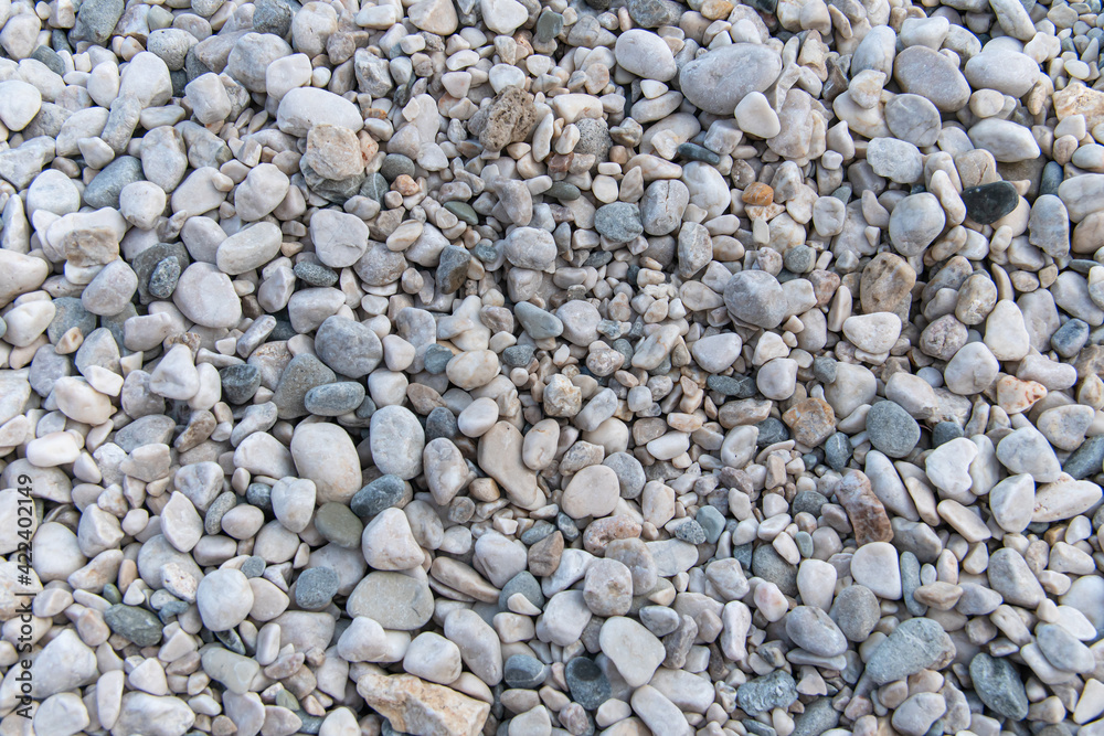 Pebbles beach on sea surface with grey stones: Abstract Composition for background and texture. Pebbles beach on sea surface with grey stones: Abstract Composition for background and texture.