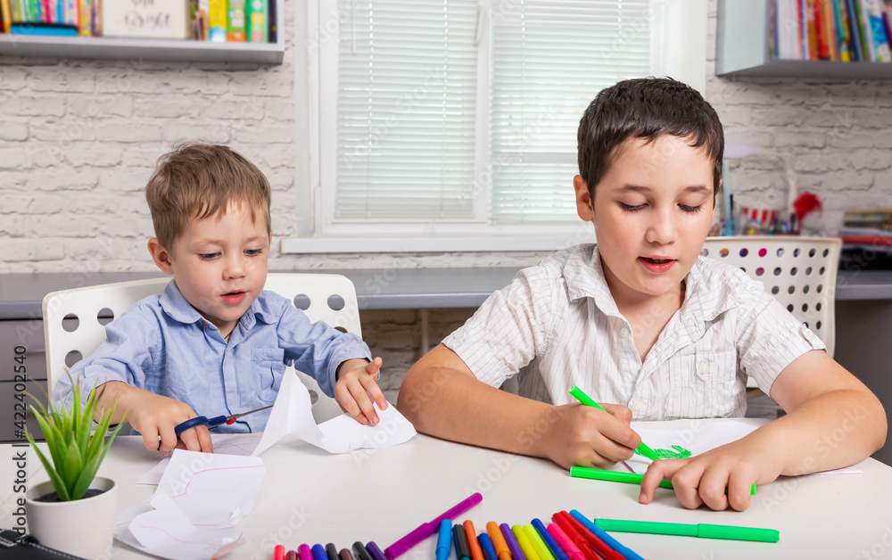 Kids draw in creativity at home together. Children are painting in kindergarten. Cute boys studying drawing at school. Happy family drawing pictures. Preschooler little boy drawing in nursery room Kids draw in creativity at home together. Children are painting in kindergarten. Cute boys studying drawing at school. Happy family drawing pictures. Preschooler little boy drawing in nursery room
