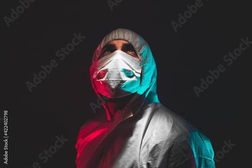 doctor under a white light blue and red black background