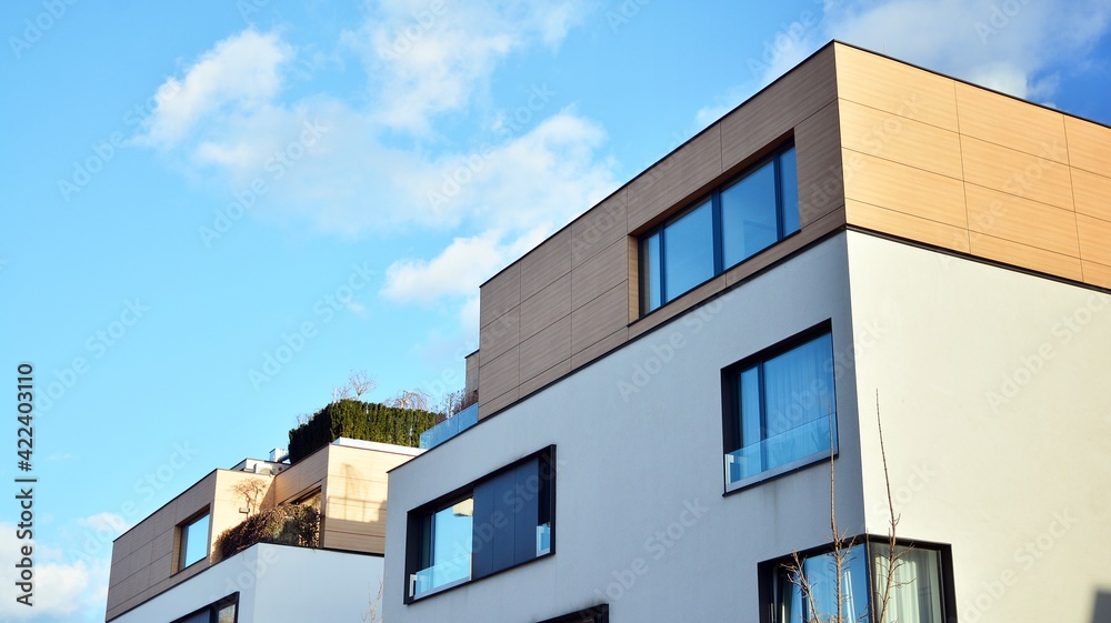 Image of condo on afternoon with sun set. Contemporary white residential building against a blue sky. Ideal for illustration of real estate or investment concepts. Image of condo on afternoon with sun set. Contemporary white residential building against a blue sky. Ideal for illustration of real estate or investment concepts.