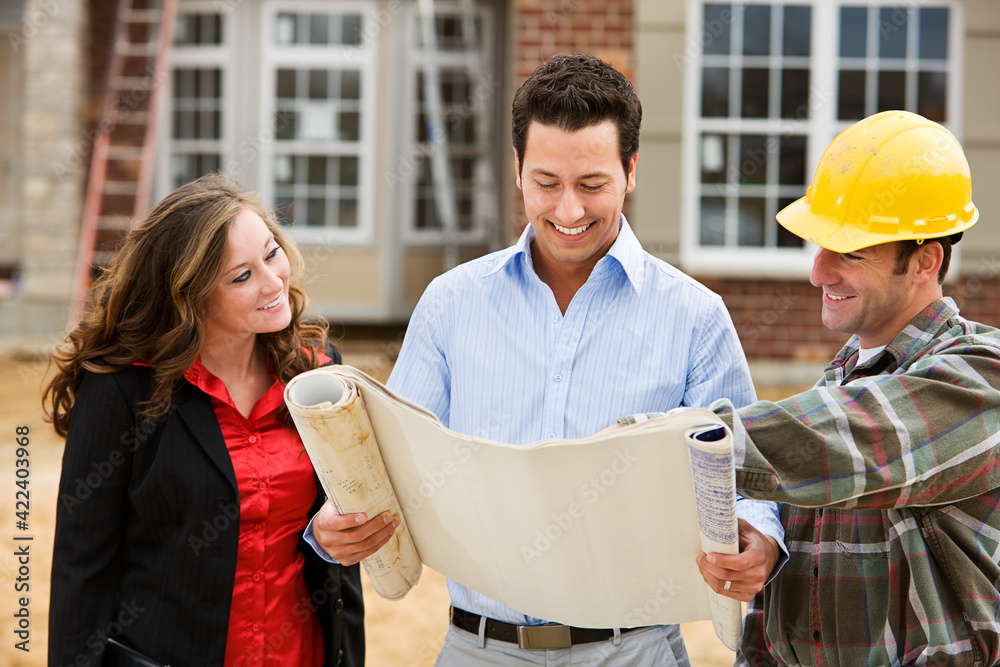 Construction: Architect Reviews Plans with Builder