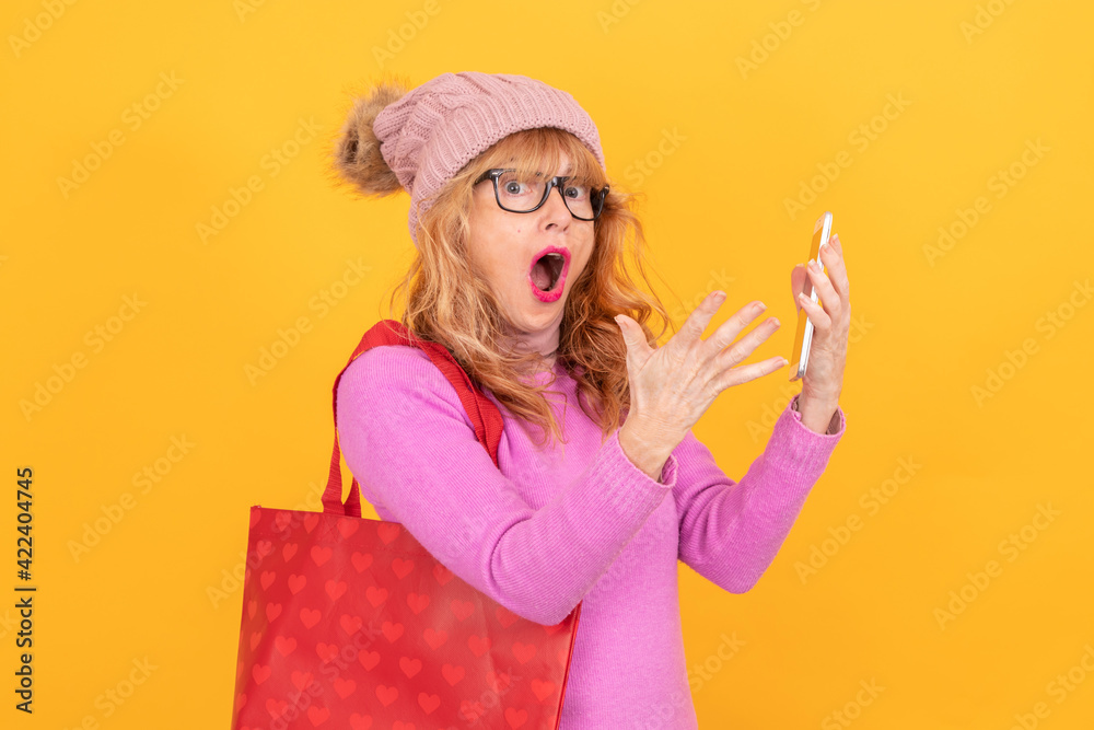 woman with bag and mobile phone isolated on background woman with bag and mobile phone isolated on background