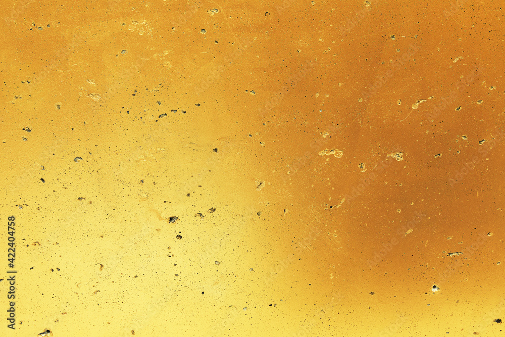 Image of gold grunge outdoor polished concrete wall texture. Abstract background for luxury vintage design