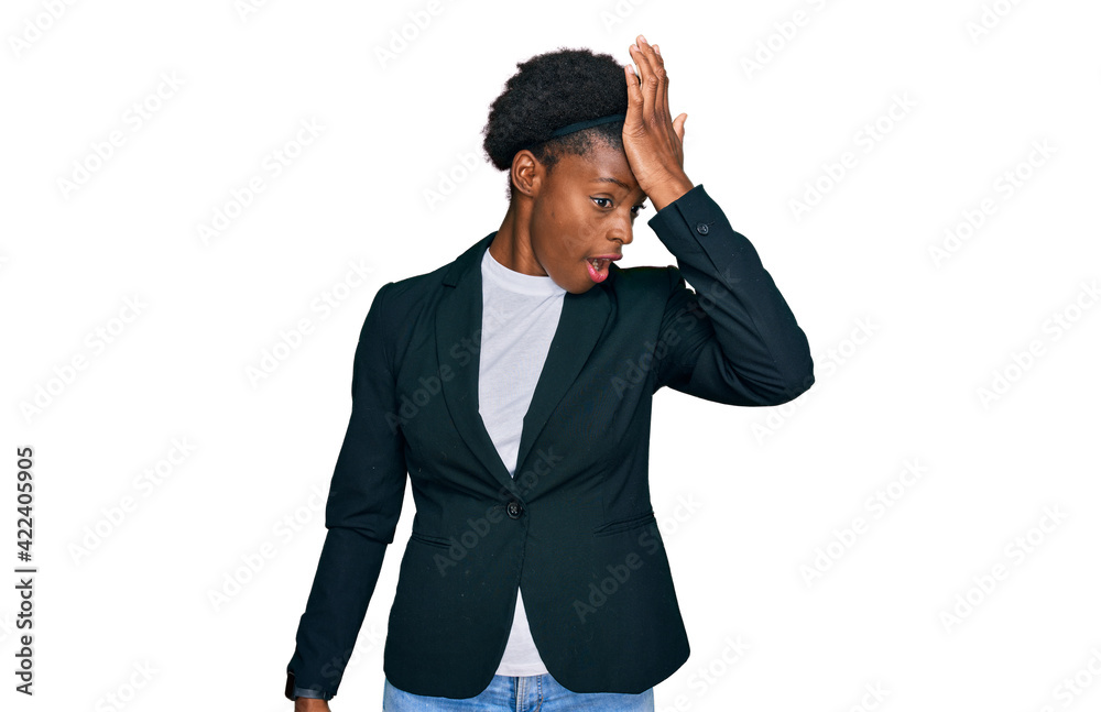 Young african american girl wearing business clothes surprised with hand on head for mistake, remember error. forgot, bad memory concept. Young african american girl wearing business clothes surprised with hand on head for mistake, remember error. forgot, bad memory concept.