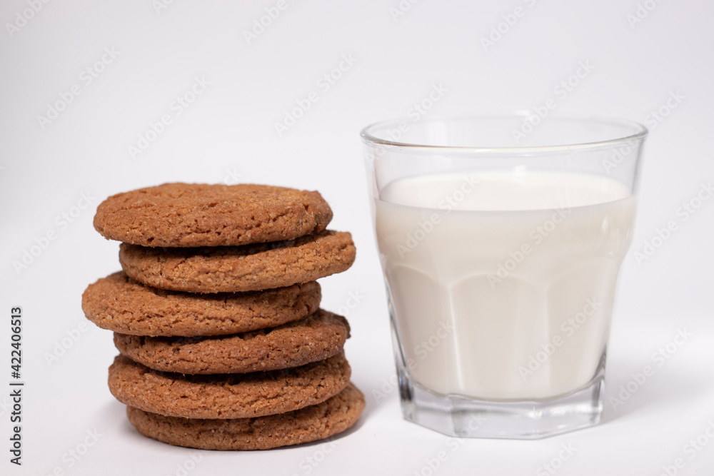 oat cookies with a glass of milk isolated on white background oat cookies with a glass of milk isolated on white background