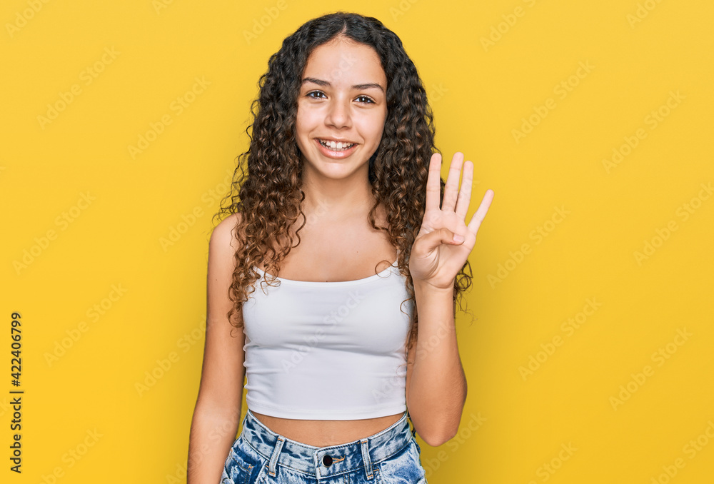 Teenager hispanic girl wearing casual clothes showing and pointing up with fingers number four while smiling confident and happy. Teenager hispanic girl wearing casual clothes showing and pointing up with fingers number four while smiling confident and happy.