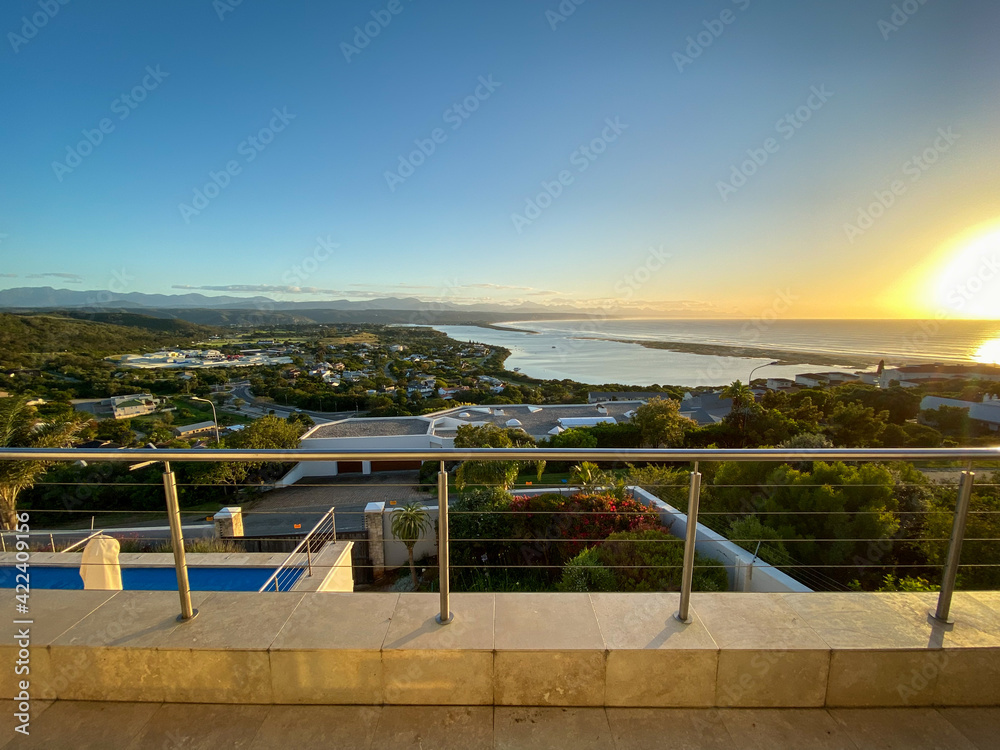 Panoramic view over Plettenberg Bay and Keurboomsrivier, South Africa at sunrise.