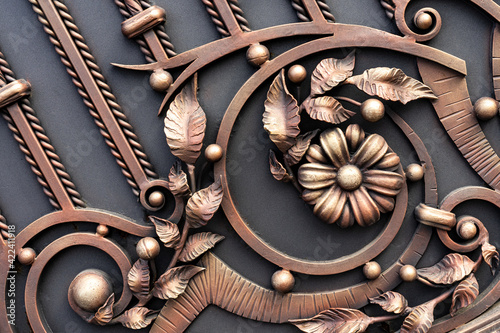 ornate wrought-iron elements of metal gate decoration photo