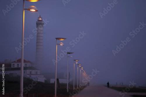 Seafront in a foggy night