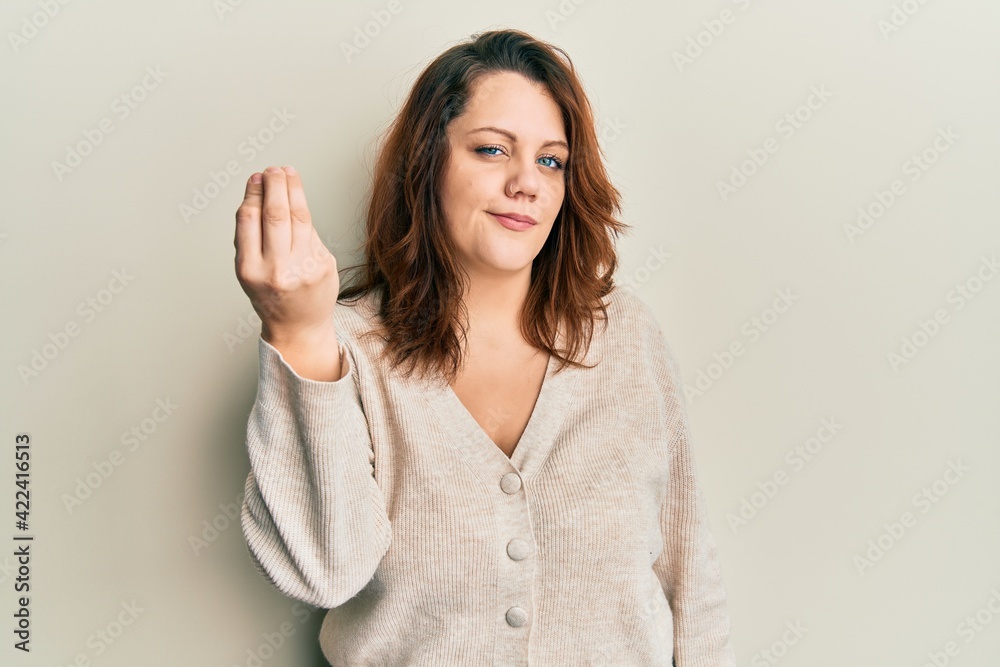 Young caucasian woman wearing casual clothes doing italian gesture with hand and fingers confident expression Young caucasian woman wearing casual clothes doing italian gesture with hand and fingers confident expression