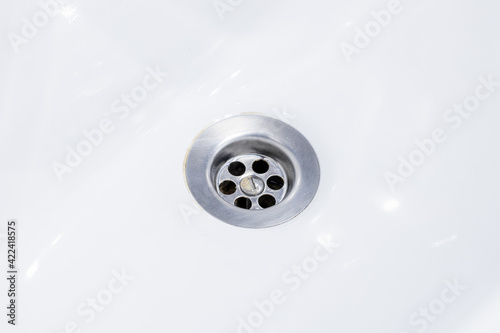 clean sink drain close up. background for plumber service