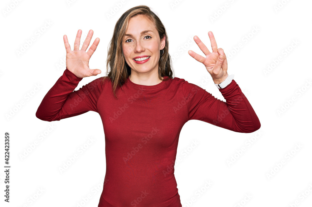 Young blonde woman wearing casual clothes showing and pointing up with fingers number eight while smiling confident and happy. Young blonde woman wearing casual clothes showing and pointing up with fingers number eight while smiling confident and happy.