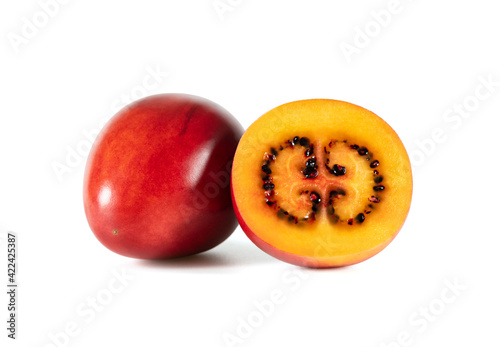 Tamarillo fruit isolated on a white background. Juicy sliced tamarillo. photo