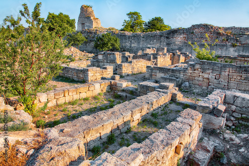 Awesome sunset over ruins of ancient city Tauric Chersonese - national historical and archaeological reserve.