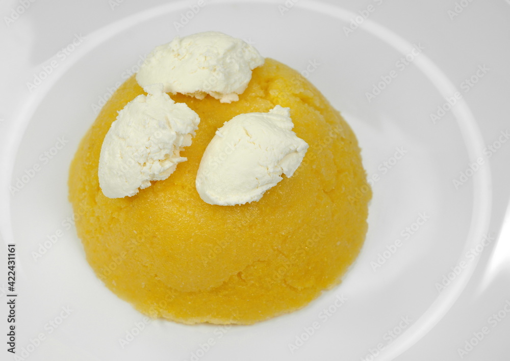 Polenta with Cheese and Sour Cream in a Plate isolated on white background. Polenta with Cheese and Sour Cream in a Plate isolated on white background.