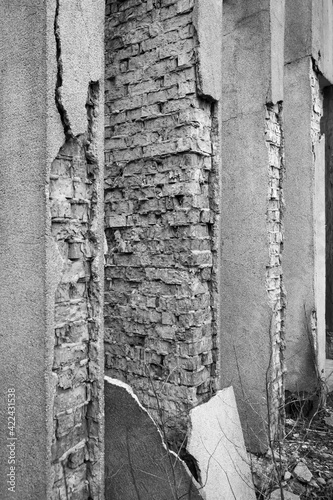 Fragment of the structure of the columns of a red brick building in a city built in the USSR. The plaster has collapsed and needs to be repaired. Photographed in Ukraine  Kiev.