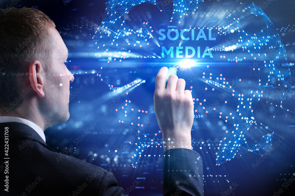 Business, Technology, Internet and network concept. Young businessman working on a virtual screen of the future and sees the inscription: Social media Business, Technology, Internet and network concept. Young businessman working on a virtual screen of the future and sees the inscription: Social media