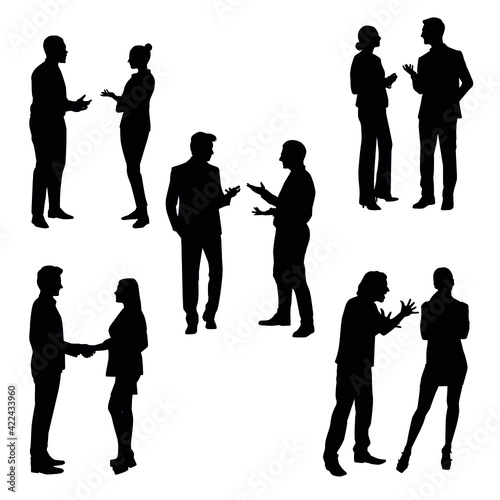 The Silhouette Of Two People Discussing