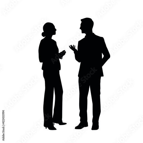 The Silhouette Of Two People Discussing
