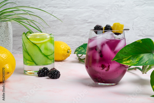 Blackberry and cucumber cocktail in a a bright summer setting