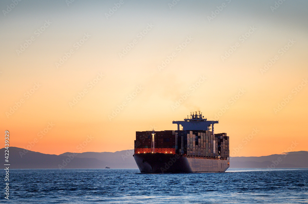 A container ships sails into the Port of Vancouver from English Bay. A container ships sails into the Port of Vancouver from English Bay.