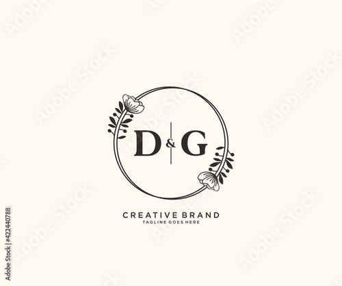 initial DG letters hand drawn feminine and floral botanical logo suitable for spa salon skin hair beauty boutique and cosmetic company.