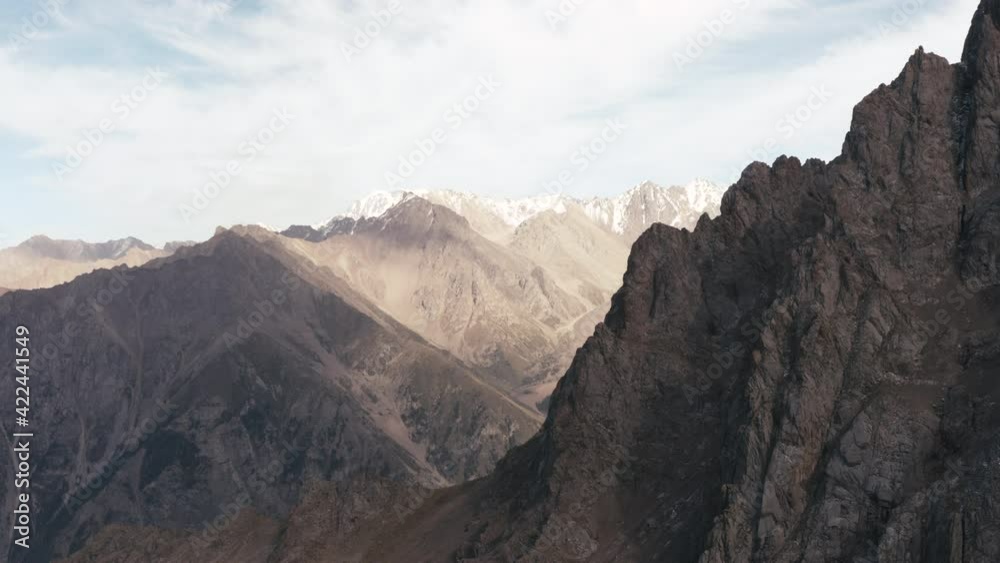 4K Panoramic view to the mountains with a lot of snow on them. Beautiful nature landscape aerial view wide open at sunny day 4K Panoramic view to the mountains with a lot of snow on them. Beautiful nature landscape aerial view wide open at sunny day