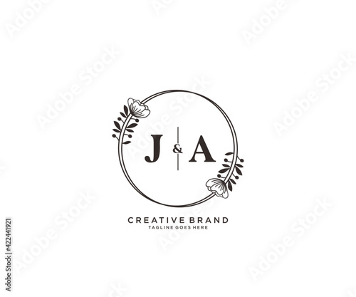 initial JA letters hand drawn feminine and floral botanical logo suitable for spa salon skin hair beauty boutique and cosmetic company.