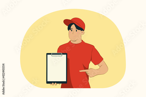 Delivery young man pointing index finger at blank clipboard concept