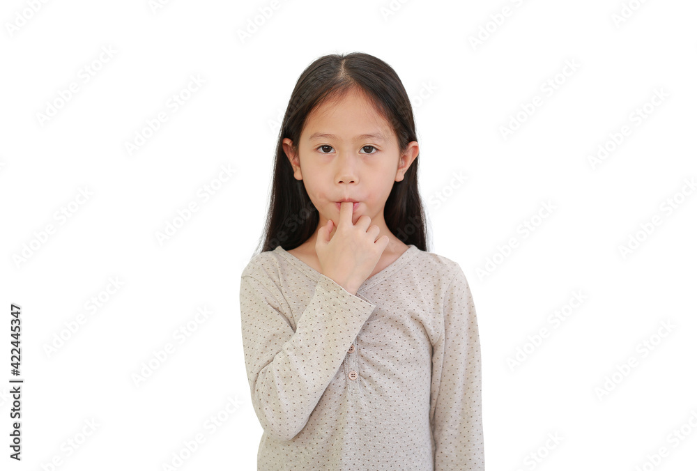 Asian little child girl sucking finger in his mouth isolated on white background. Asian little child girl sucking finger in his mouth isolated on white background.