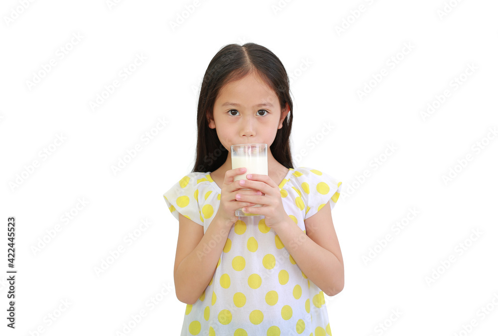 Asian little child girl drinking milk from glass isolated on white background Asian little child girl drinking milk from glass isolated on white background