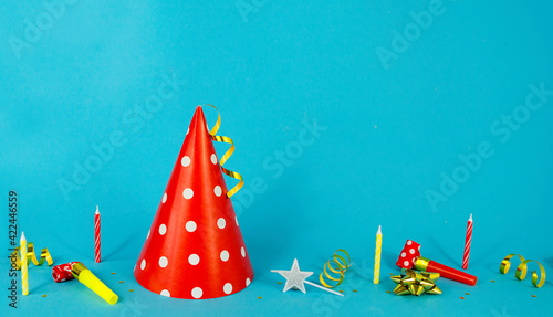 Happy birthday background:party hat, balloons, flute, serpentine, stars.